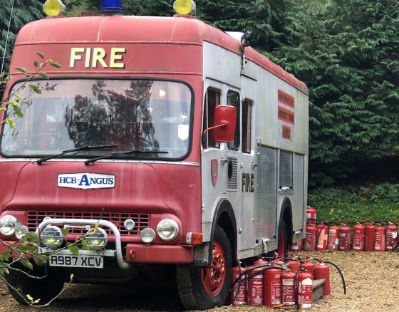 Fire Engine camper in Blackberry Wood photo by Faith Bleasdale