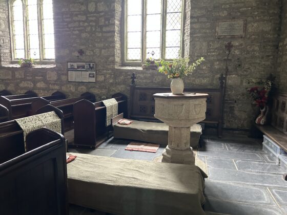 Camping beds set up inside the church for Champing by Faith Bleasdale